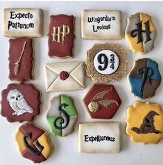 decorated cookies are arranged in the shape of harry potters houses and hogwart's crests