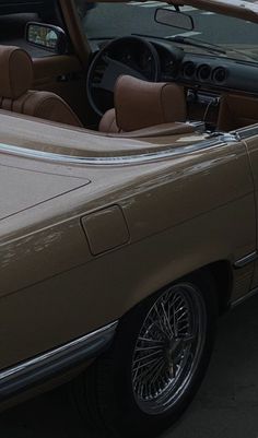 the interior of a car is tan and brown