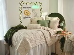 a bedroom with white walls and green accents