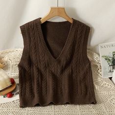 Basic sleeveless v-neck vest with a braided texture in our signature soft knit. One Size: 35.5" chest, 19.5" length Brown Knit V-neck Vest, Casual V-neck Cable Knit Sweater Vest, Brown V-neck Sweater Vest For Winter, Brown V-neck Vest For Winter, Brown Knitted V-neck Top, Brown Knit V-neck Sweater Vest, Brown V-neck Knit Sweater Vest, Brown V-neck Sweater Vest For Fall, Brown V-neck Sweater Vest