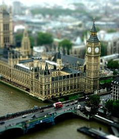 the big ben clock tower towering over the city of london, england as seen from above