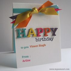 a card with the words happy birthday written on it and a bow at the top