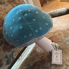 a blue mushroom sitting on top of a chair