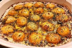 a casserole dish filled with lots of different types of food on top of it