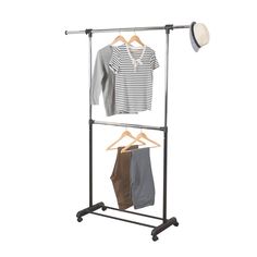 a clothes rack with two shirts hanging on it