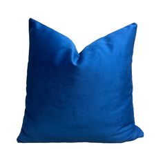 a blue pillow on a white background with no one in the photo to describe it