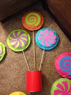 colorful paper lollipops sitting on the floor