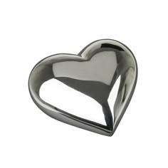 a metal heart shaped object on a white background