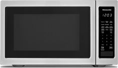 a microwave oven with the door open and timer on it's side, in front of a white background