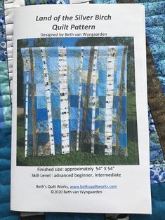 an advertisement for the quilter's book land of the silver birch quilt pattern