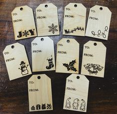 six wooden tags with christmas designs on them