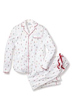 Cozy up in these luxuriously soft cotton twill pajamas covered in a whimsical nutcracker print and designed with elevated details like piped edges. Top has front button closure; notched collar; long sleeves with one-button cuffs; chest patch pocket Pants have elastic/drawstring waist; side-seam pockets 100% cotton Machine wash, dry flat Imported Luxury Sleepwear, Santa Outfit, Loungewear Dresses, Sugar Plum Fairy, Winter Family, Mens Pajamas Set, Christmas Pjs, Cotton Pajama Sets, The Nutcracker