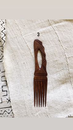 "Natural wood combs hand carved by artisans in Africa. Made in Senegal. Size varies 10-12\"L x 2.5\"W Sold individually, not a set. Return to shop: Afrohemien.etsy.com Like and Follow Afrohemien for updates, sales, coupons and surprise giveaways Instagram/Blog: instagram.com/Afrohemien Tumblr: Afrohemien.tumblr.com Facebook: www.facebook.com/Afrohemien Twitter: twitter.com/Afrohemien" African Comb, Afrocentric Style, Afro Comb, Afro Pick, Wood Mask, African Earrings, African Decor, Hair Wraps, African Jewelry