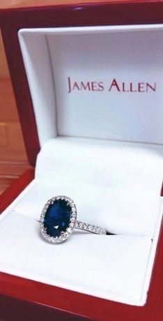 a blue stone ring in a red box