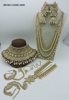 an assortment of gold jewelry on display