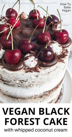 vegan - black forest cake with whipped coconut cream and cherries on top is shown