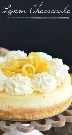 a lemon cheesecake on a cake stand