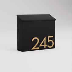 a black box with gold numbers on it