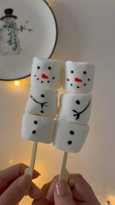 marshmallows with snowman faces on them