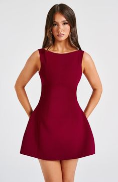 The ultimate mini dress. Alana is made in our premium crepe fabric with a flirty bubble shape skirt which is super voluminous. The high neck design is finished with seam details and a scoop back. Pair with sleek waves and tonal mule heels. Colour: Wine. Premium non-stretch crepe fabric. Fully lined. Seam detail. Scoop back. Bubble shape. voluminous skirt. High. boat shape neckline. Mini length. Model is an XS and is wearing an XS. Model is an F-cup size. Cocktails Birthday, Sleek Waves, Homecoming Dresses Corset, Evening Cocktails, Midi Dress Wedding Guest, Voluminous Skirt, Mode Tips, Mule Heels, High Neck Designs