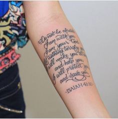 a woman with a tattoo on her arm that says, don't be afraid