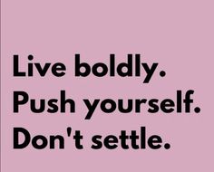 the words live boldly push yourself, don't setle on a pink background