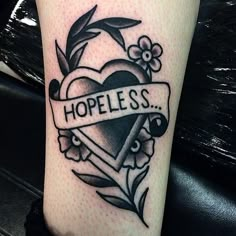 a black and white photo of a heart with the word hopeless on it's side