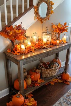 Entryway table styling for autumn with natural elements Fall Entry Table Decor Entryway, Fall Entry Table Decor, Fall Entry Table, Living Room Halloween, Halloween Living Room Decor, Fall Entryway Decor, Fall Entry, Halloween Living Room, Entry Table Decor