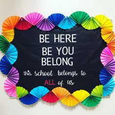 a sign that says be here, be you belong it's school belongs to all of us