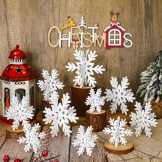 snowflakes and christmas decorations on a wooden table