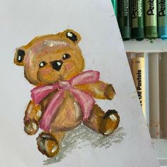 a drawing of a brown teddy bear with a pink bow