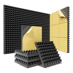 an image of a set of black and gold acoustic sound absorbing panels in front of a yellow wall