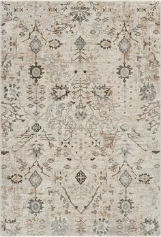 an area rug with various colors and patterns on the ground, including beiges, browns,