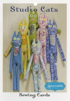 the sewing pattern for stuffed cats is shown in front of a card with an image of several