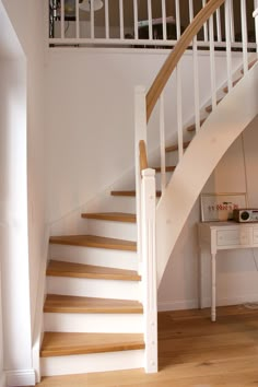 there is a white stair case in the room