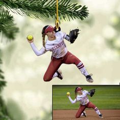 an ornament shaped like a female baseball player catching a ball with her glove