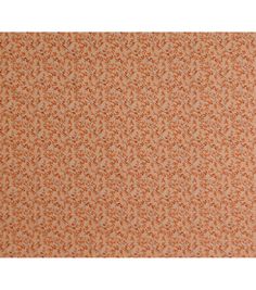 an orange and white wallpaper with small leaves on the top, in different colors