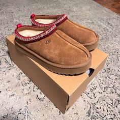 These Uggs Are Big Kids Size 5y Us (37 Eu) Which Can Fit A Size 6 Or 6.5 Womens. They Are The Youth Platform Tasmans [Tazz] With The Red Embroidery. The Platform On These Tasmans Are Not As High As The Women’s Tazz Which I Personally Prefer. The Platform Is About 1” High Super Cute And Cozy. Please Feel Free To Send Me A Message For Any Questions :) Red Tasman Uggs, Uggs Tazz, Tazz Ugg, Shoe Essentials, Shopping Vibes, Cute Uggs, Ugg Tazz, Fluffy Shoes, Ugg Tasman Slippers