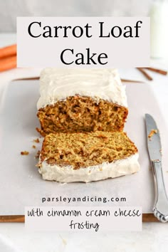 carrot loaf cake with cinnamon cream cheese frosting on a white plate next to a fork