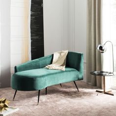 a living room with a blue couch and white walls