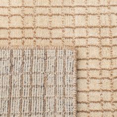 an area rug with two different colors and patterns on the carpet, one is beige