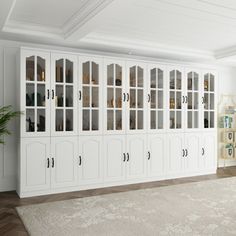 a large white bookcase in the middle of a room with lots of glass doors