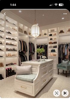 a walk in closet filled with lots of clothes