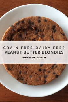 grain free dairy free peanut butter blondies in a white bowl on a wooden table