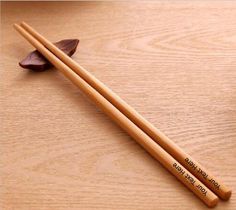 Premium Personalised Bamboo Chopsticks *  *  *  *  *  *  *  *  *  *  *  *  *  *  *  *  *  *  *  *  *  *  *  *  *  *  *  *  *  *  *  *  *  *  *  *  *  *  *  *  *  *  *  *  *  *  *  *  *  *  *  *  *  *  *  *  * Sold as 1 pair of chop sticks * Made from Natural Bamboo * Chopsticks are approx. 260 x 4 mm * Completely Customisable – Suitable for any occasion * Perfect gifts for Christmas, New Year, Birthday, Wedding, Anniversary, New Home or any otherOur personalised chopsticks are made from natural, Personalized Chopsticks, Bamboo Chopsticks, Chop Sticks, Etsy Wedding Favors, Gifts For Christmas, Laser Engraving Machine, Wedding Bows, Halloween Items, Photo On Wood