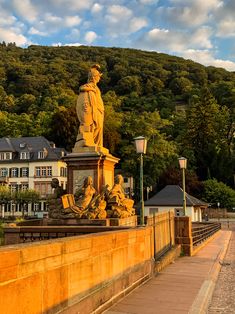 there is a statue on the side of this bridge