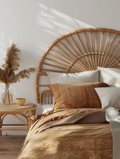 a bamboo headboard in a bedroom next to a wicker table with a vase on it