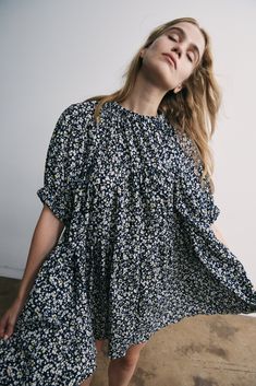 The Theo Dress is an oversized babydoll silhouette with elastic at the sleeve and neck. Floral print adds a pop of color and charm. Loose fit and flowy design in a lightweight seersucker fabric to add a subtle texture to the dress. 100% Japanese Cotton Seersucker Machine was delicate and hang to dry. Spring Voluminous Mini-length Dress, Spring Voluminous Mini Dress, Spring Mini Length Voluminous Dress, Spring Daywear Dresses With Bubble Hem, Spring Dresses With Bubble Hem For Daywear, Spring Bubble Hem Dresses For Daywear, Flowy Puff Sleeve Short Dress For Day Out, Flowy Puff Sleeve Dress For Day Out, Billowy Bubble Hem Summer Dress