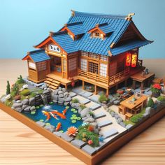 a model of a japanese house with koi fish swimming in the pond and rocks surrounding it