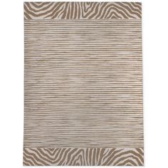 an animal print rug with brown and white stripes